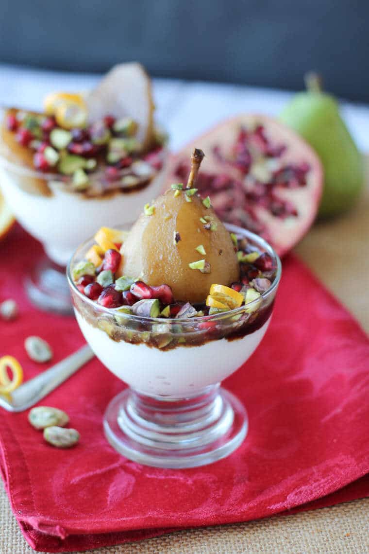 An angled photo of two cups of poached pear with one in focus.