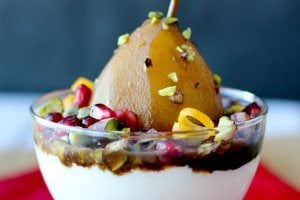 This slow cooker pomegranate poached pears is a vegan and gluten free treat that is refined sugar free! Perfect for healthy entertaining this holiday season!