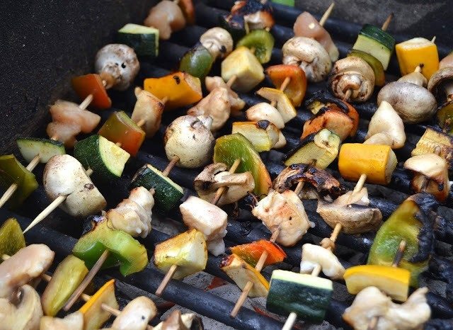 Chicken kebabs on a grilling pan.