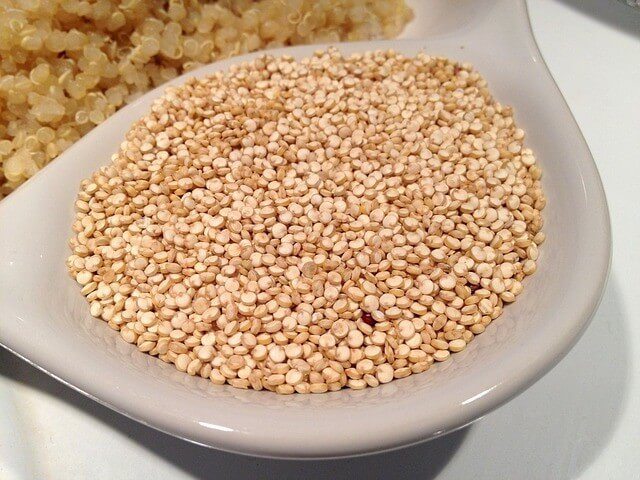 A bowl of uncooked quinoa.