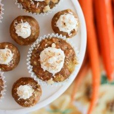 An overhead photo of multiple carrot cake cupcakes on a serving platter.