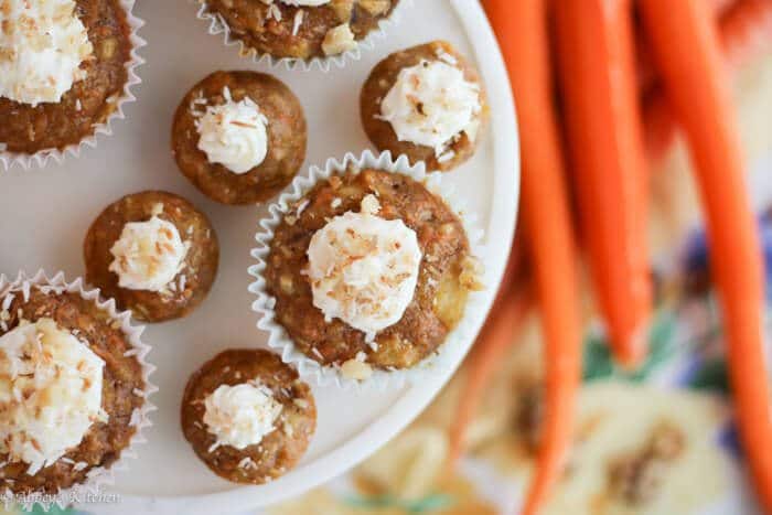 An overhead photo of multiple carrot cake cupcakes on a serving platter.