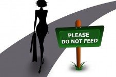 A cartoon of a woman beside a sign "Please Do Not Feed."