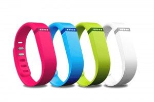 Four colourful fitbits.