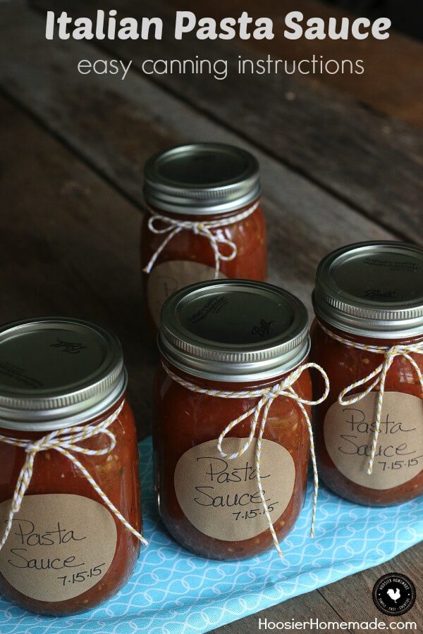 Four cans of canned pasta sauce.