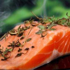 A close up of a slice of salmon before getting baked.