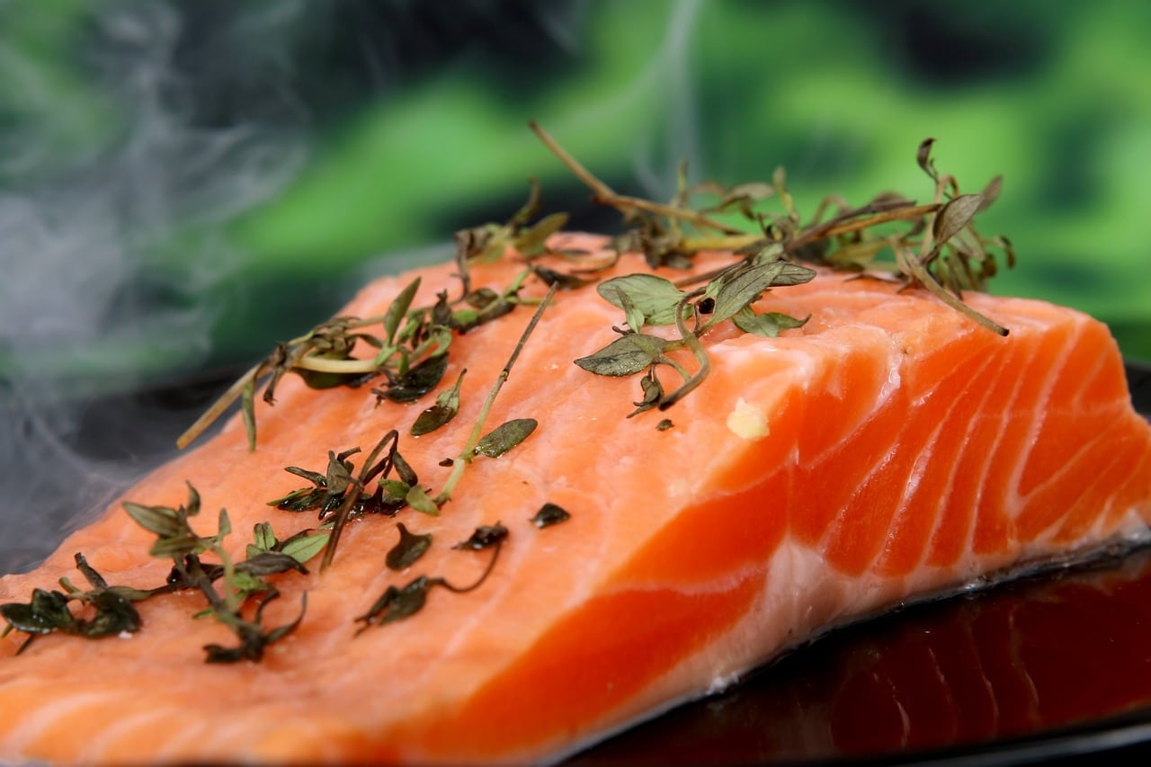 A close up of a slice of salmon before getting baked.