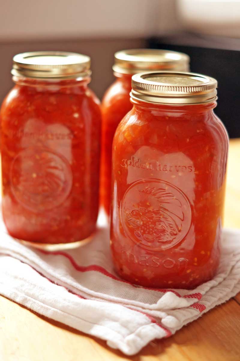 Three mason jars of chipotle salsa.