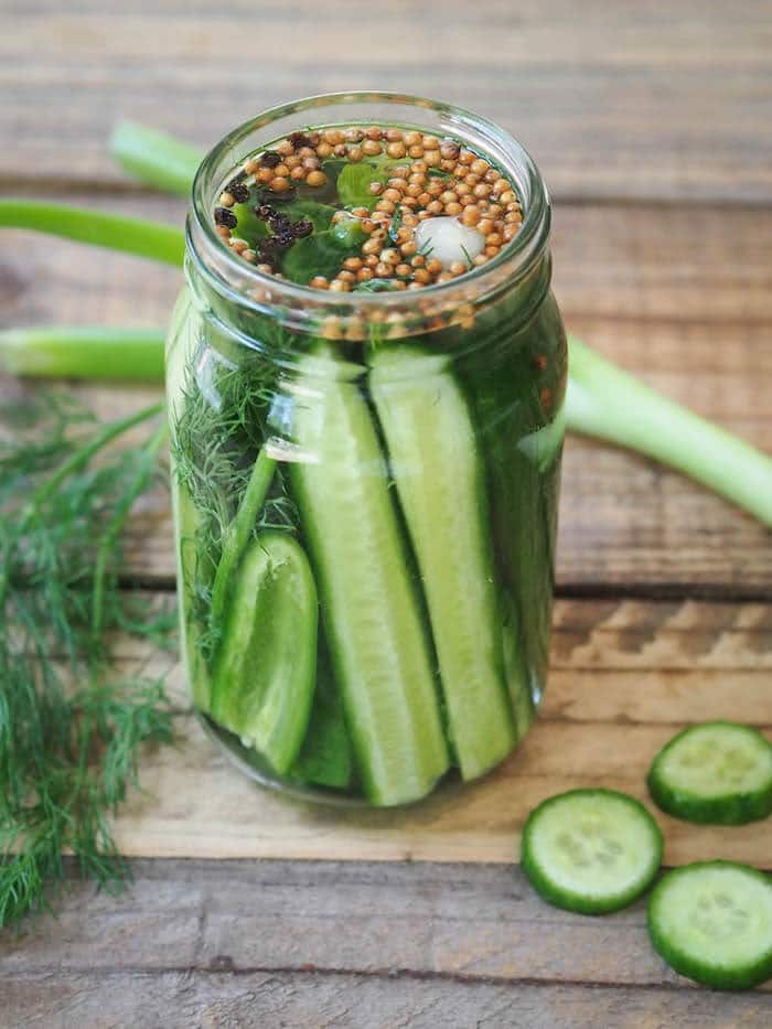 A jar of fermented pickles.