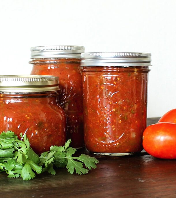 Three jars of fiery roasted salsa.