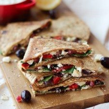 A close up of a hummus quesadillas on a serving platter.