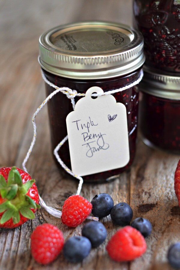 A mason jar of triple berry jam.