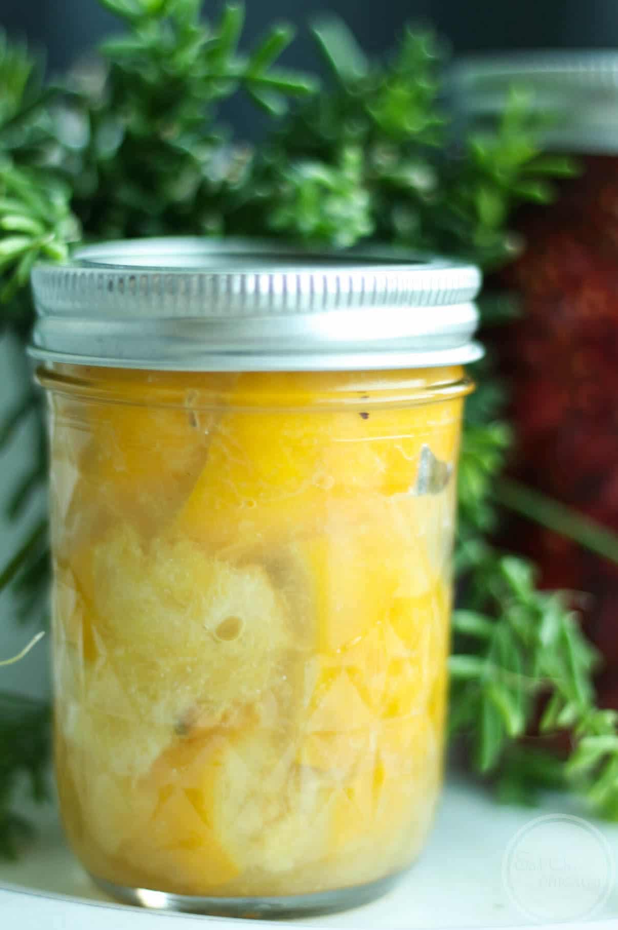 A mason jar of preserved lemons.