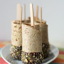 These adorable Vegan Chocolate Dipped Banana Roll-Ups on a Stick are the ultimate after school or work snack for kids or kids at heart.