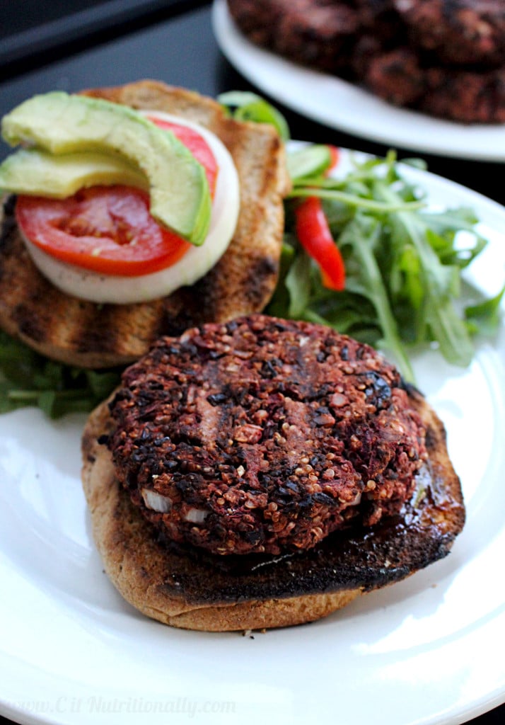 A quinoa beet burger on a plate.