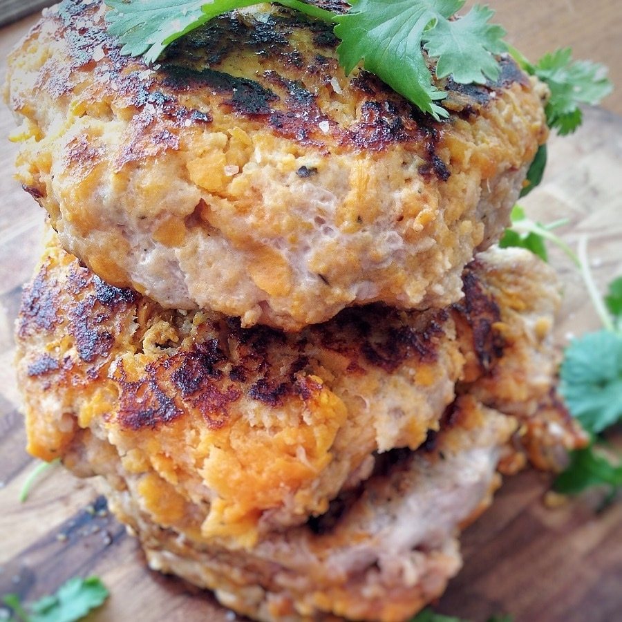 Three stacked sweet potato turkey burger patties.