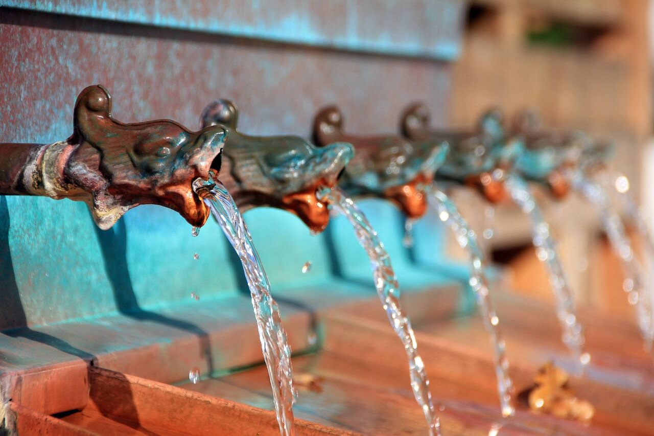 Water coming out of multiple spouts. 