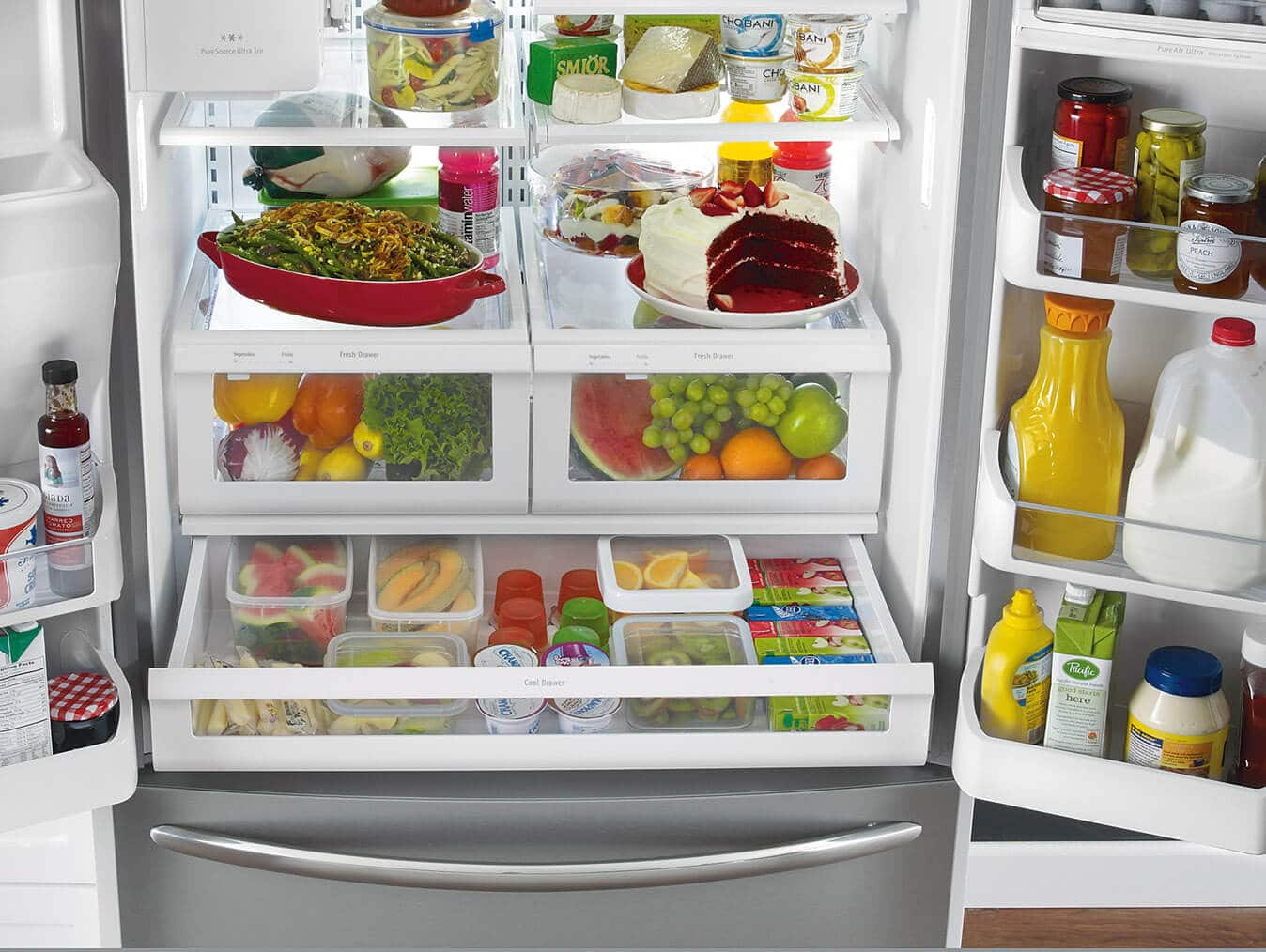 An open refrigerator filled with food.