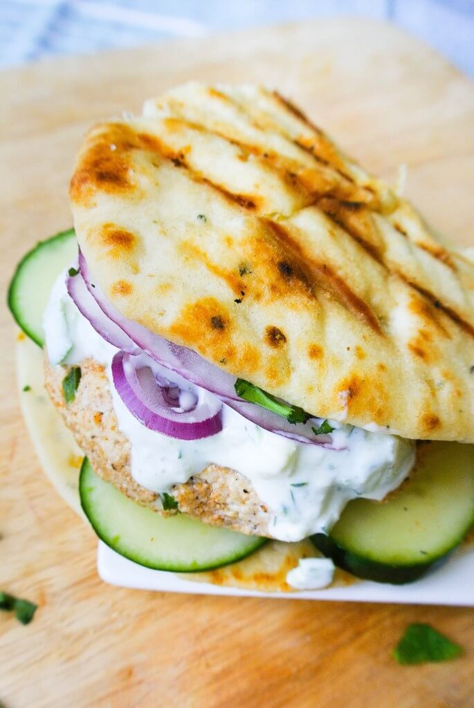 A tandoori chicken sandwich with a pita.