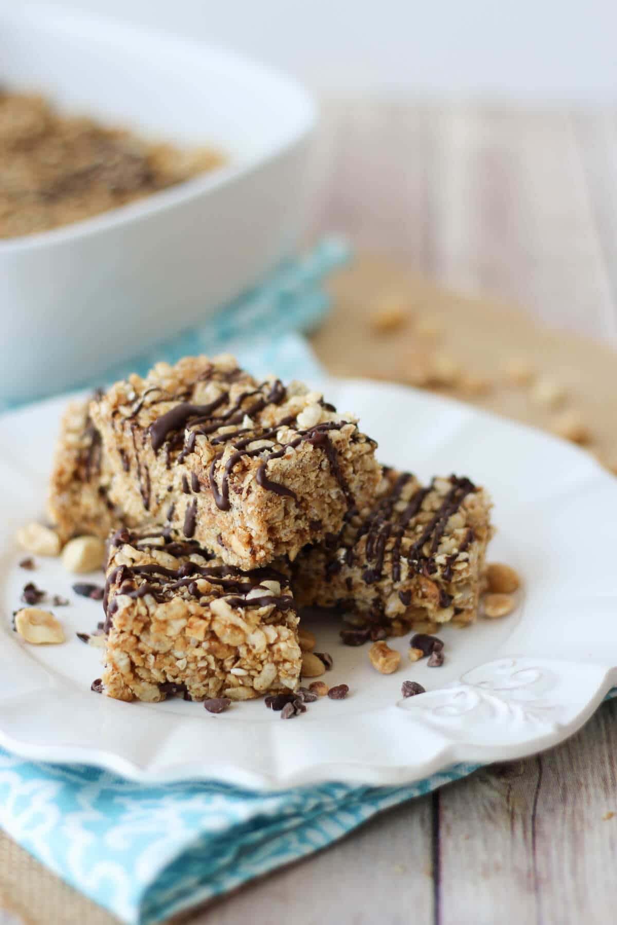 A white plate with a stack of rice cereal treats.