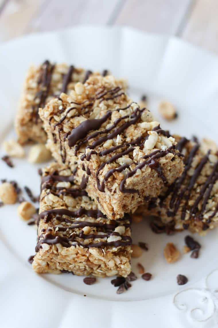 A stack of peanut butter rice krispies with chocolate drizzle.