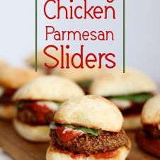 A pinterest image of multiple sliders with the text overlay "Healthy Chicken Parmesan Sliders."