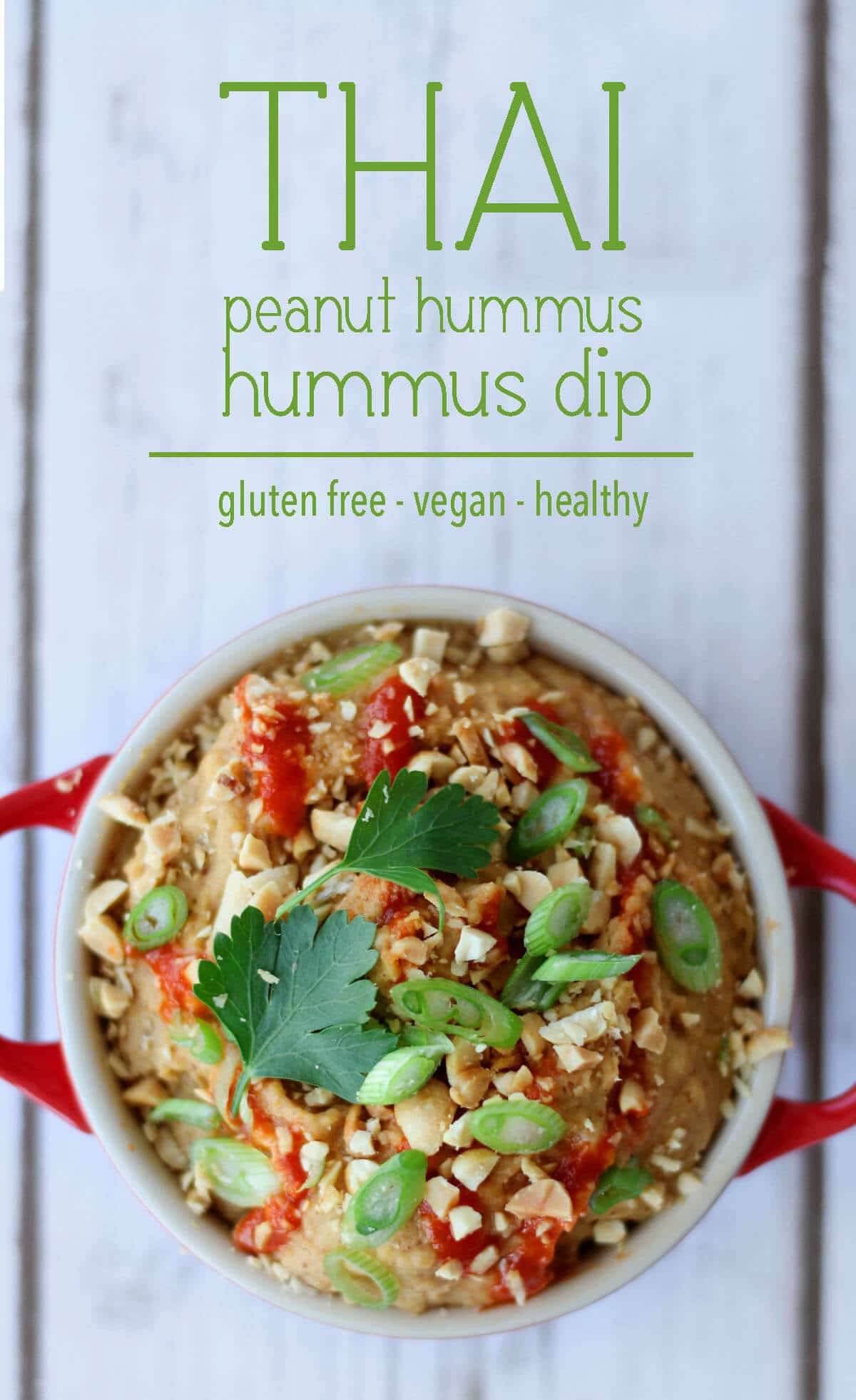 A pinterest image of an overhead photo of dip in a red bowl with the text overlay \"THAI peanut hummus dip gluten free - vegan - healthy.\"