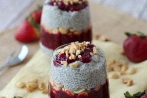 Two containers of peanut butter and jam vegan chia pudding.