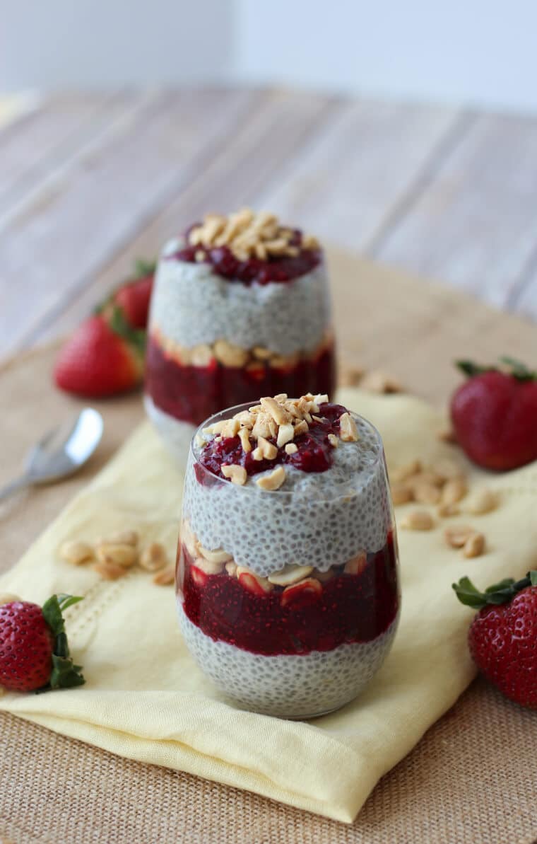 Two containers of peanut butter and jam vegan chia pudding.