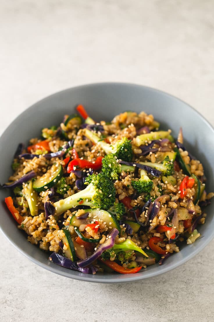 A whole of brown rice stir fry with vegetables.