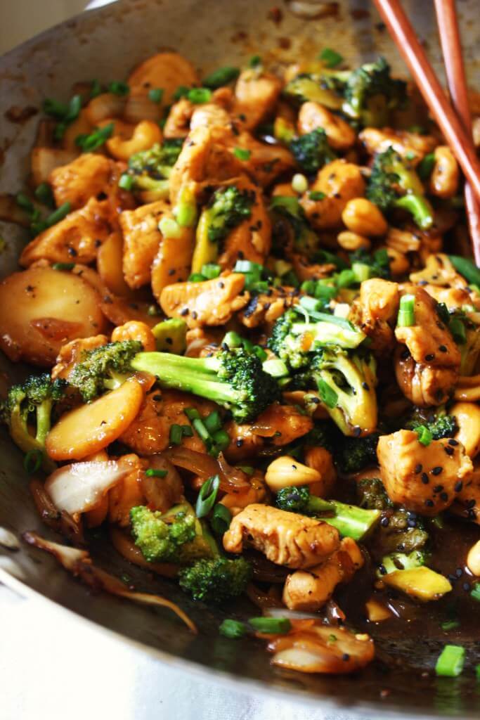 A dish with cashew chicken with broccoli.