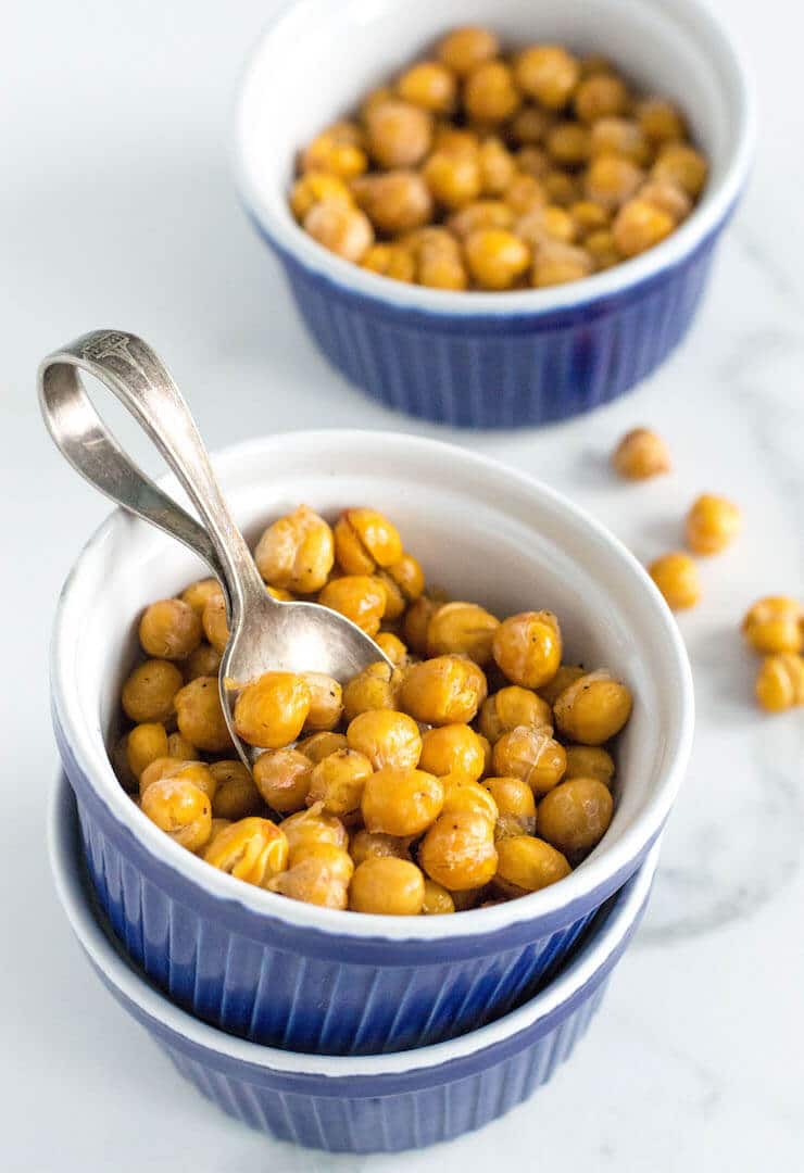 A small blue bowl of crispy chickpeas.