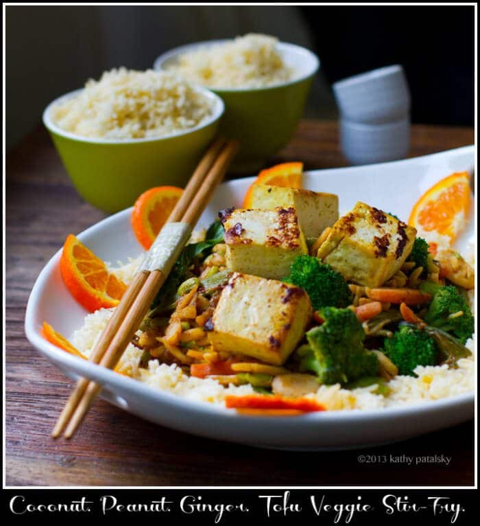 Photo of a bowl of rice with stir fry on top.