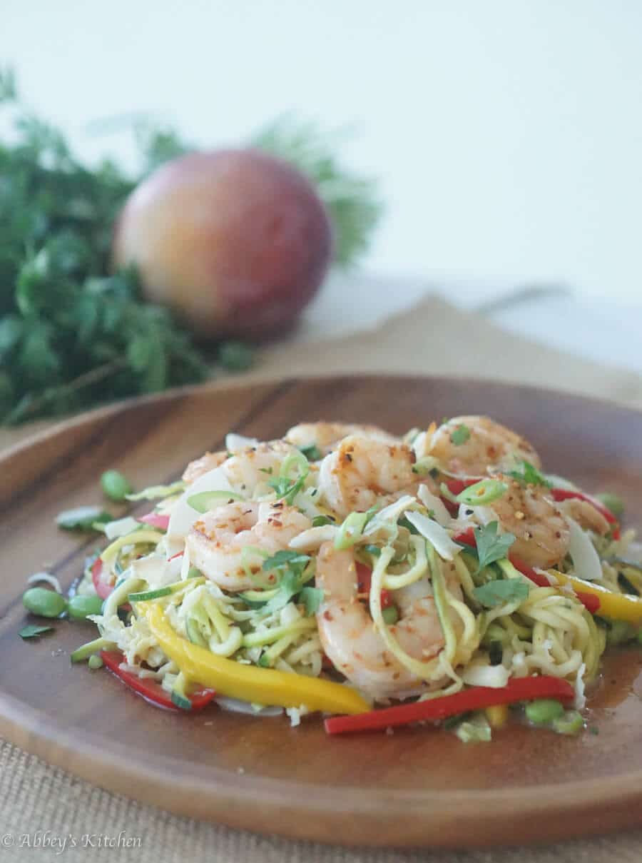 A plate of zoodles with shrimp on top.