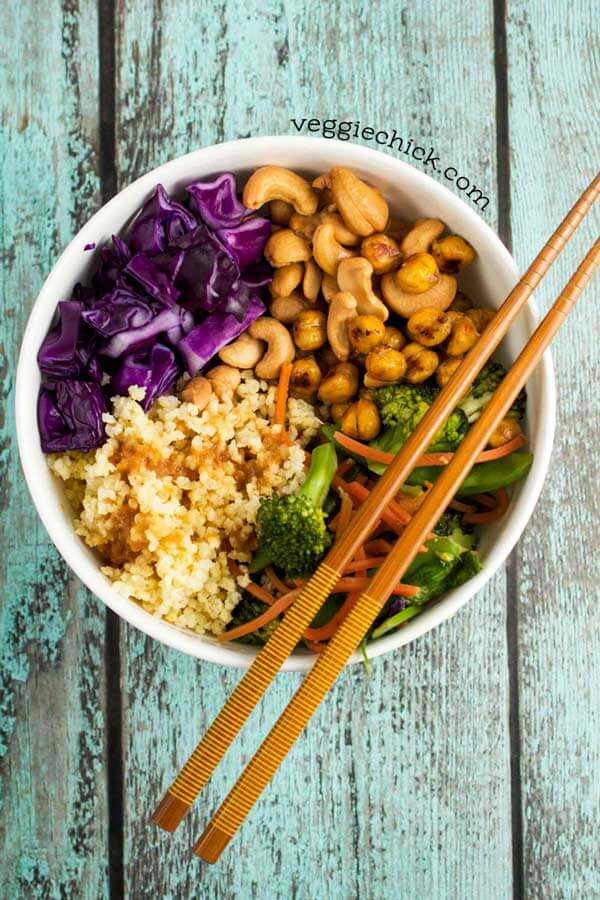 A white bowl with cashew quinoa, and vegetables.