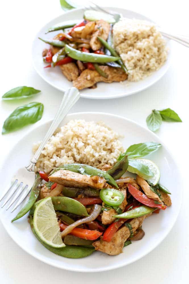 A plate of thai basil chicken stir fry.