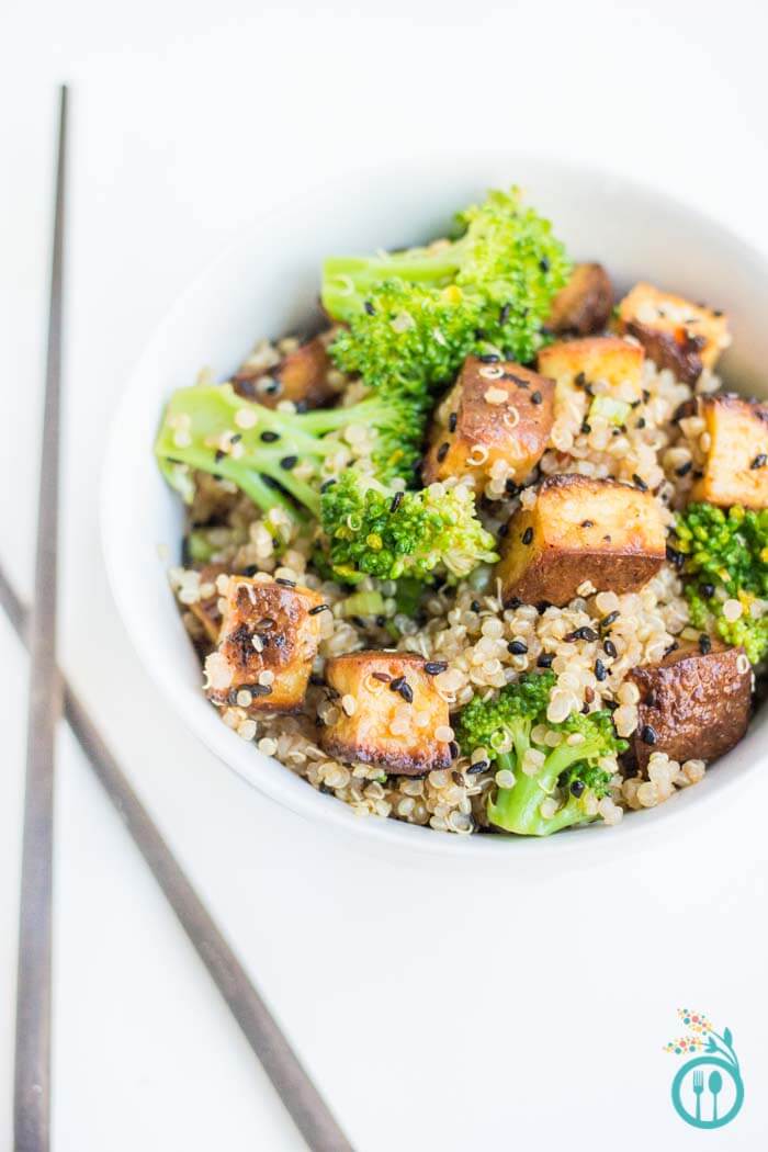 A plate of tofu broccoli quinoa stir fry.