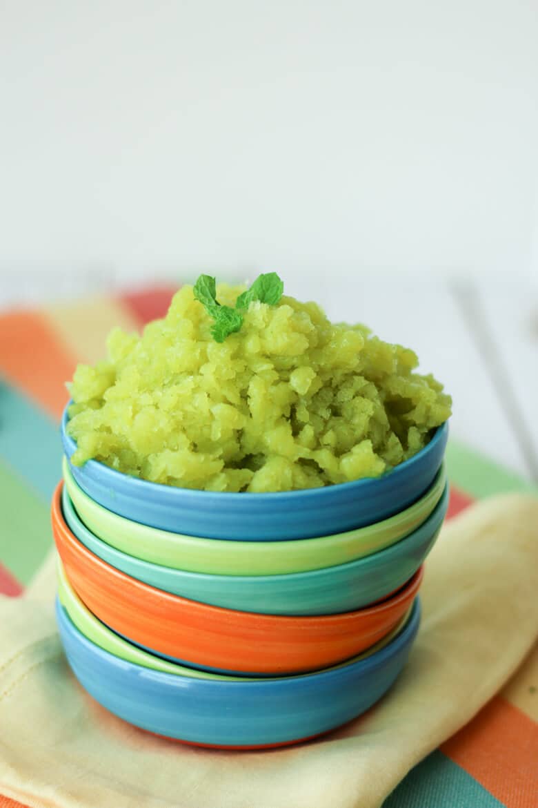 low calorie Cucumber Lime Granita in a blue bowl topped with mint