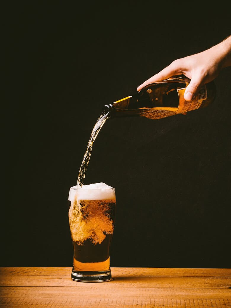 Beer being poured into a glass.