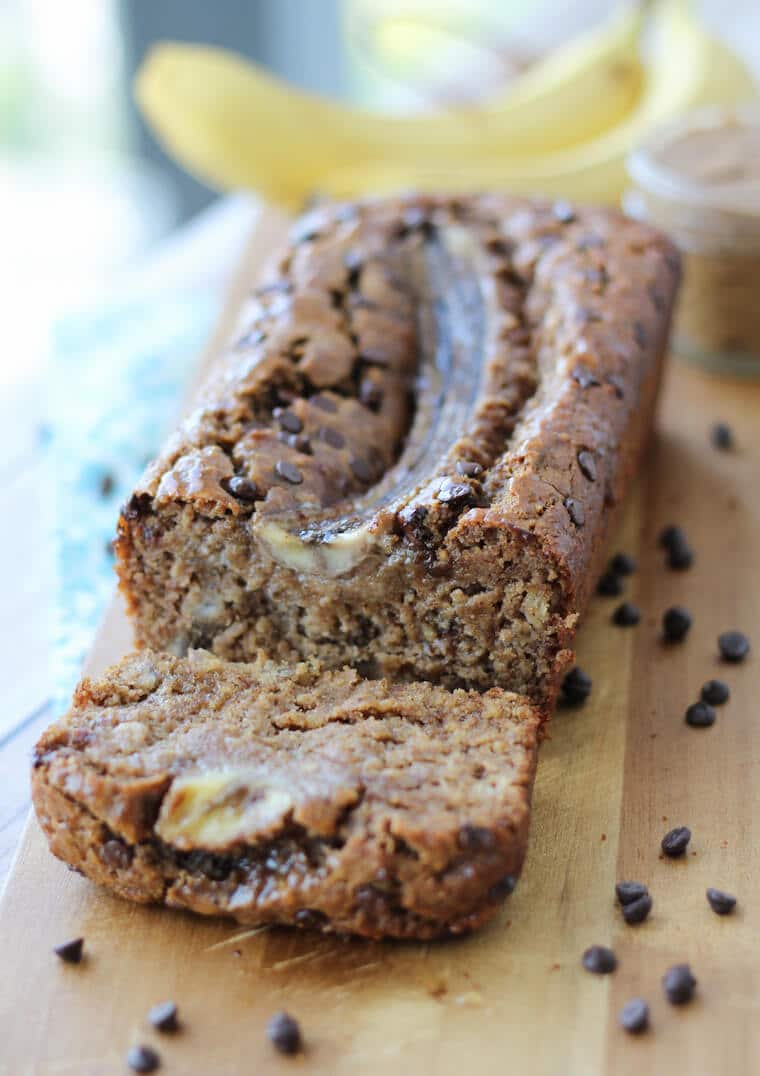 homemade chocolate chip banana bread on a wooden counter