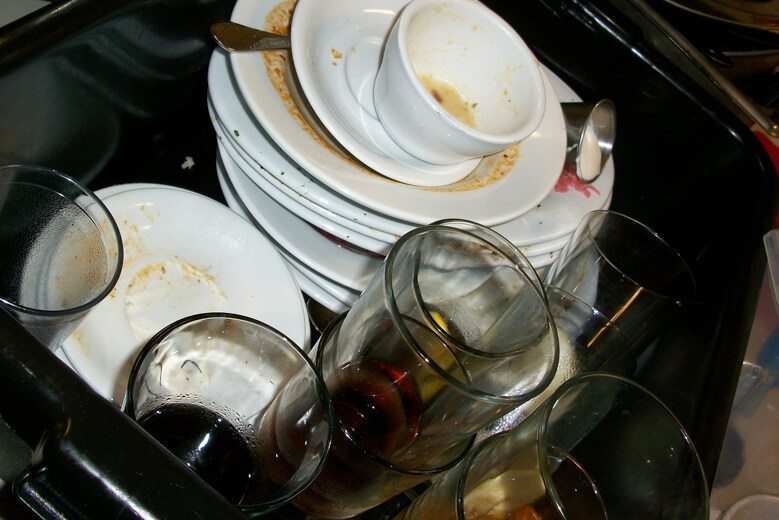 Dirty dishes in a sink.