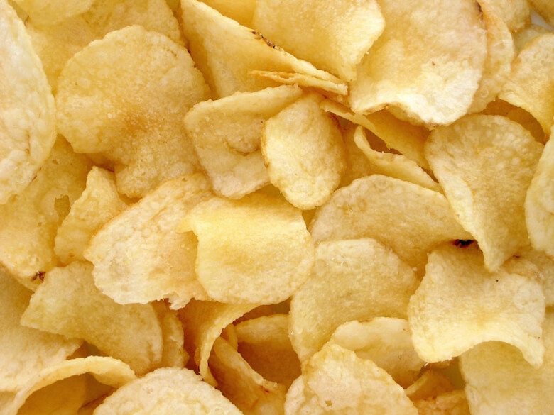 A couple up of a bunch of potato chips.