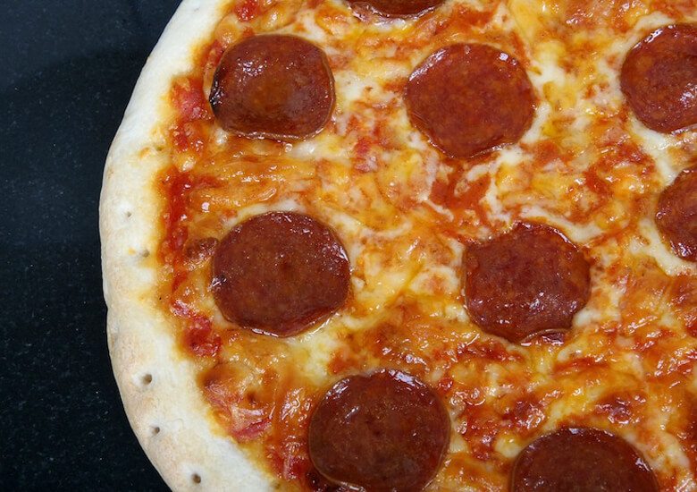 A close up of a pepperoni pizza.