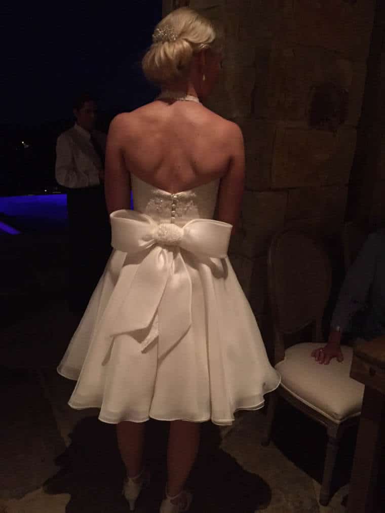 The back of a wedding dress with a bow.