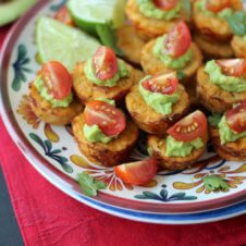 A close up of multiple Mexican cauliflower mini muffins on a plate.