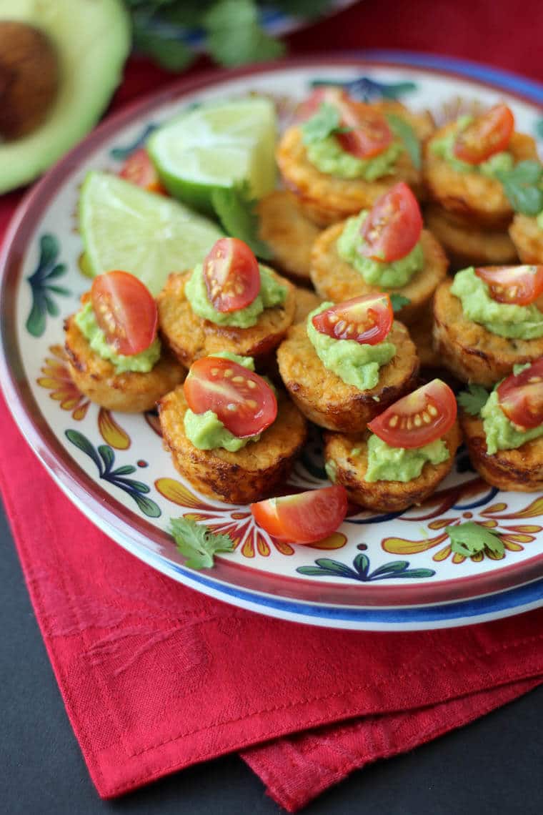 A close up of multiple Mexican cauliflower mini muffins on a plate.