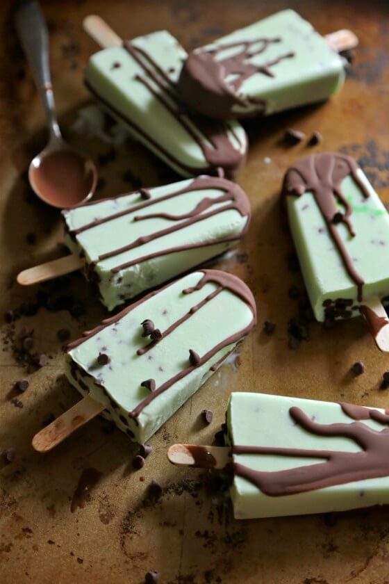 Four chocolate chip mint greek yogurt popsicles.