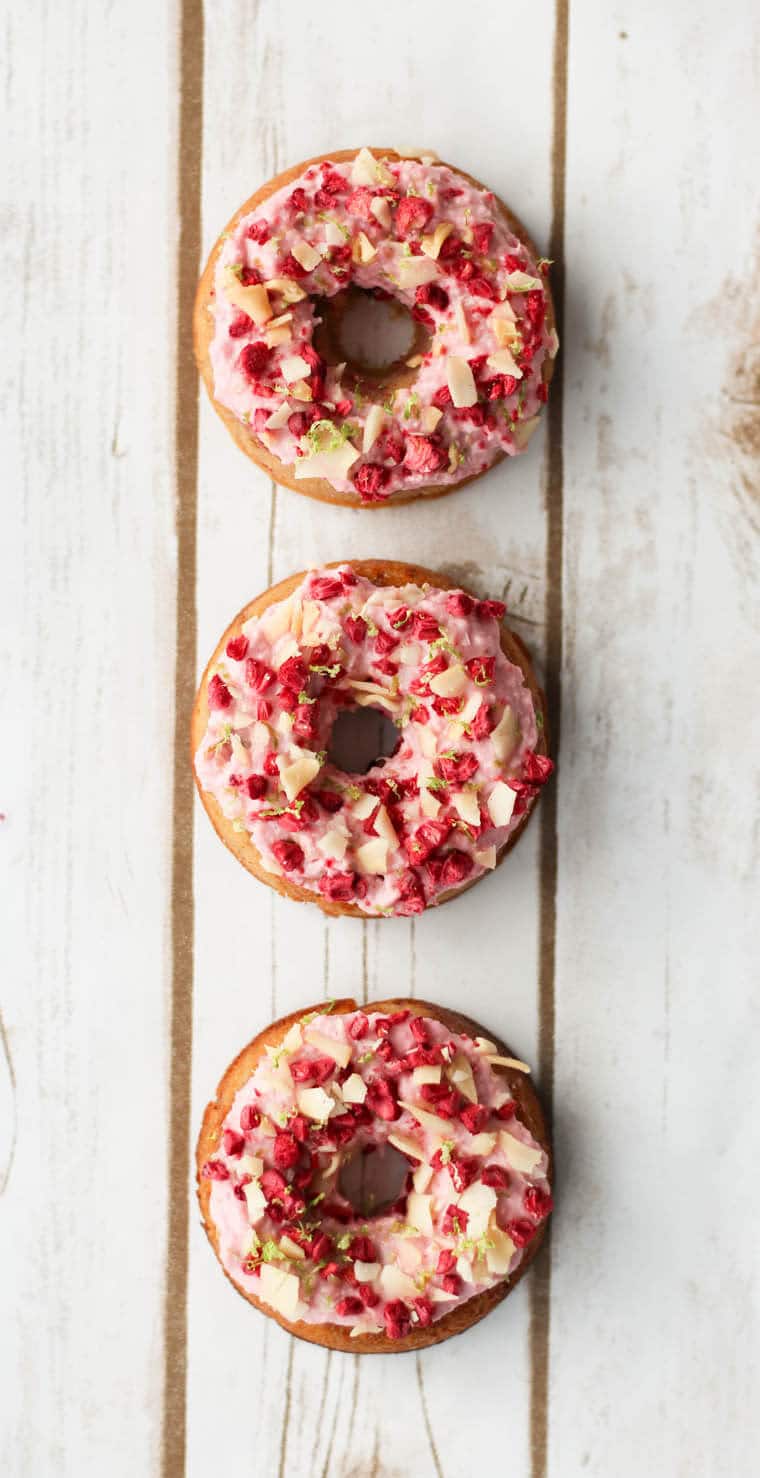 Three donuts that are raspberry margarita flavoured.