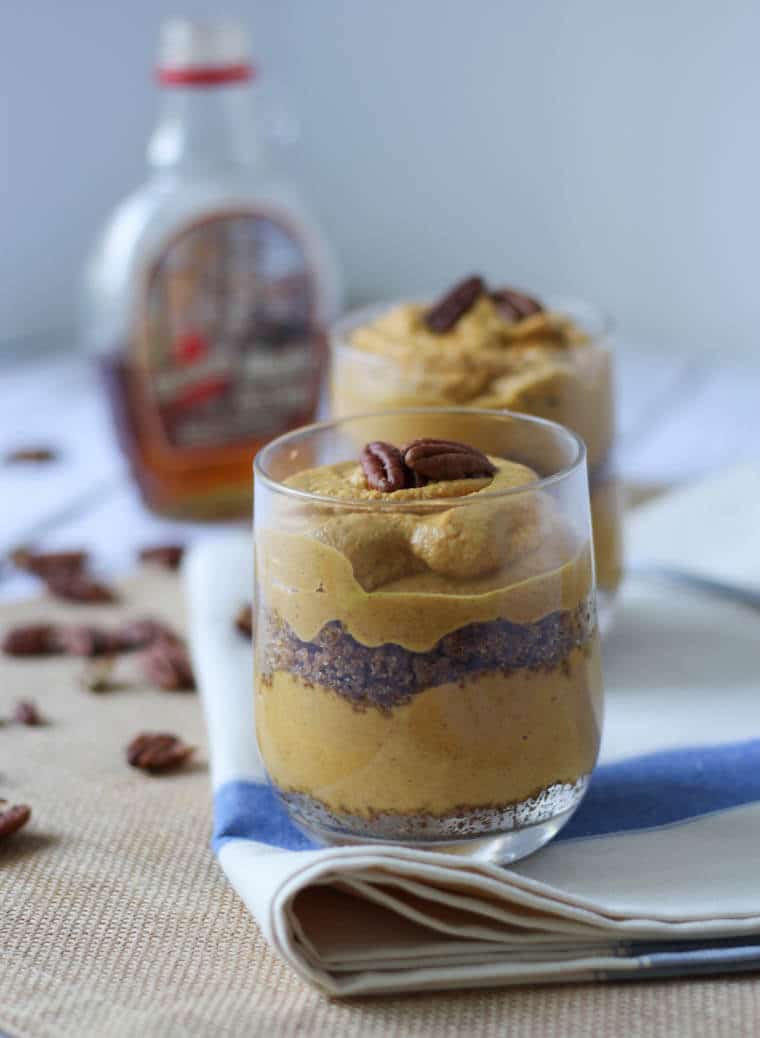 Two pumpkin parfaits with pecans.