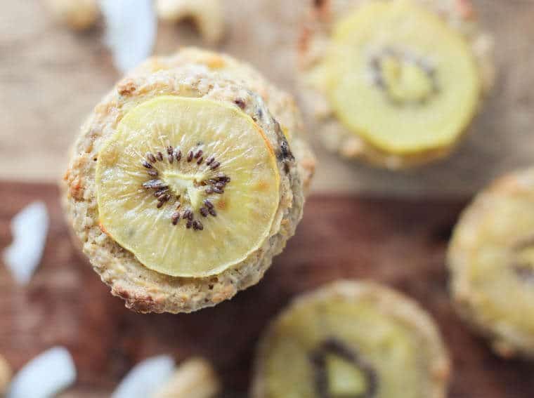 close up of tropical oatmeal muffins on a wooden counter